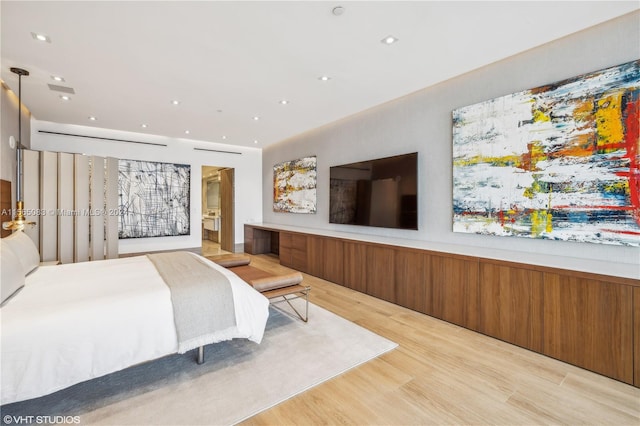 bedroom with light hardwood / wood-style flooring