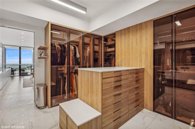 spacious closet featuring light tile floors