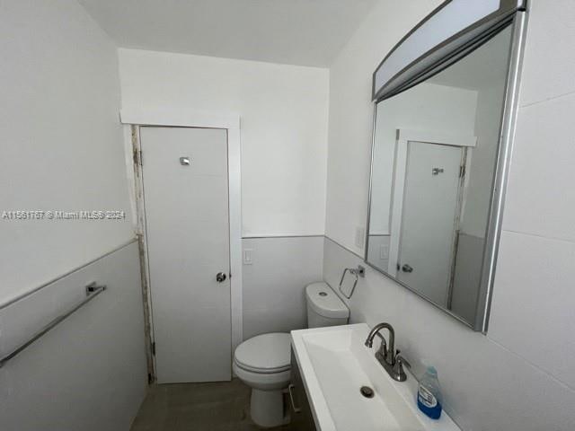 bathroom with toilet and sink