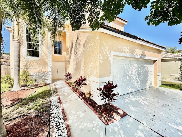 mediterranean / spanish home featuring a garage