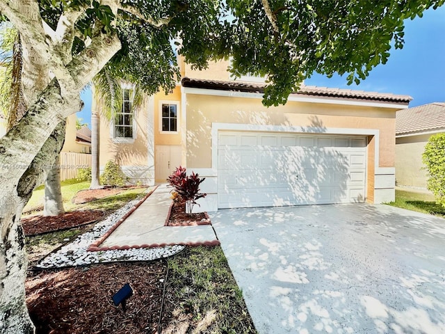 view of front of property featuring a front yard and a garage