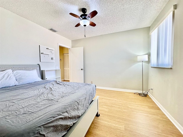 full bathroom with large vanity, toilet, and shower / bath combo with shower curtain