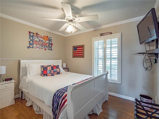 bedroom featuring multiple windows, ceiling fan, hardwood / wood-style flooring, and ornamental molding