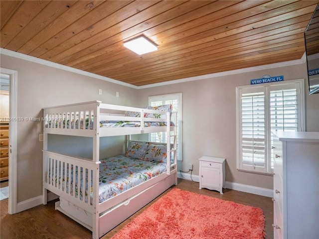 bedroom with dark hardwood / wood-style flooring, crown molding, and wood ceiling