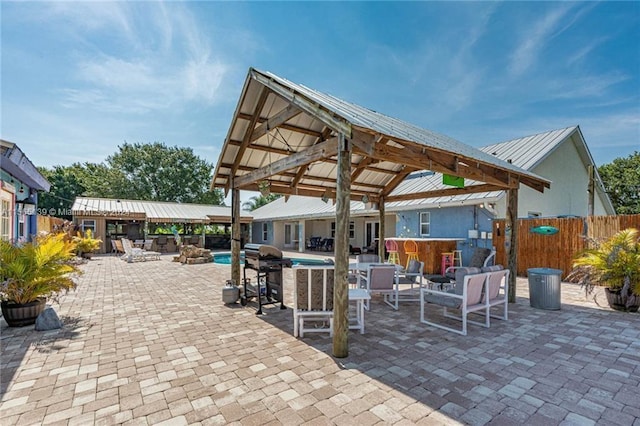 view of terrace with a fenced in pool and a gazebo