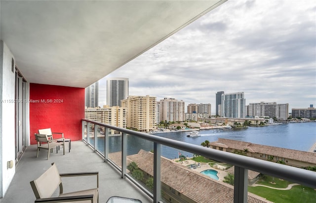 balcony featuring a water view