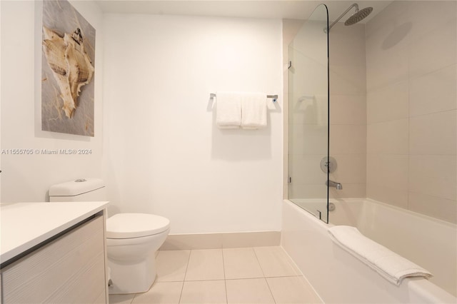 full bathroom with vanity, combined bath / shower with glass door, tile floors, and toilet