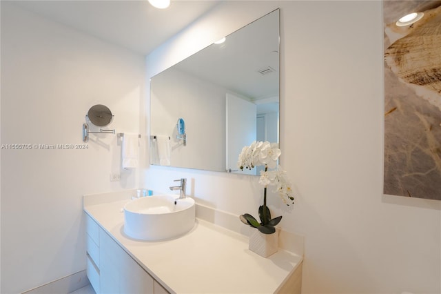 bathroom featuring vanity with extensive cabinet space