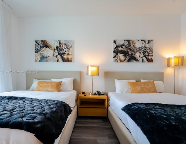 bedroom with dark wood-type flooring