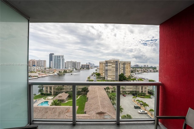 balcony featuring a water view