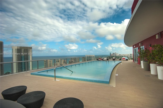 view of pool featuring a water view