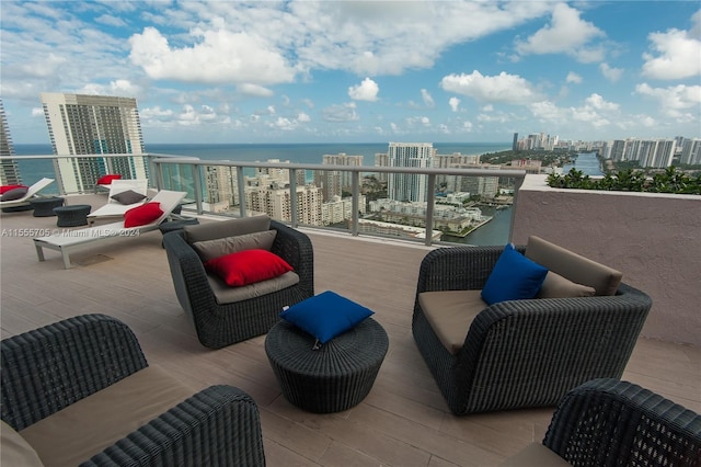 view of patio / terrace featuring a balcony and a water view