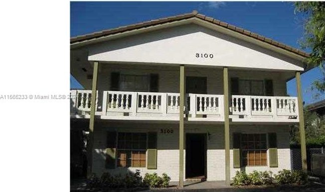 rear view of house with a balcony