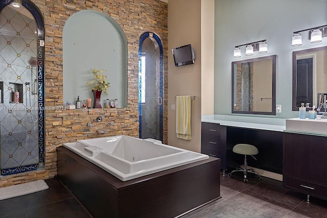 bathroom with vanity, tile floors, and a tub