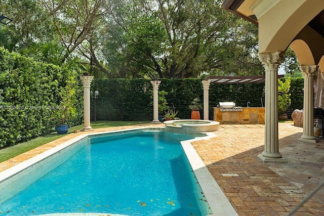 view of pool with a grill, an in ground hot tub, and a patio area