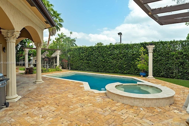 view of pool featuring a pergola, a patio area, and an in ground hot tub