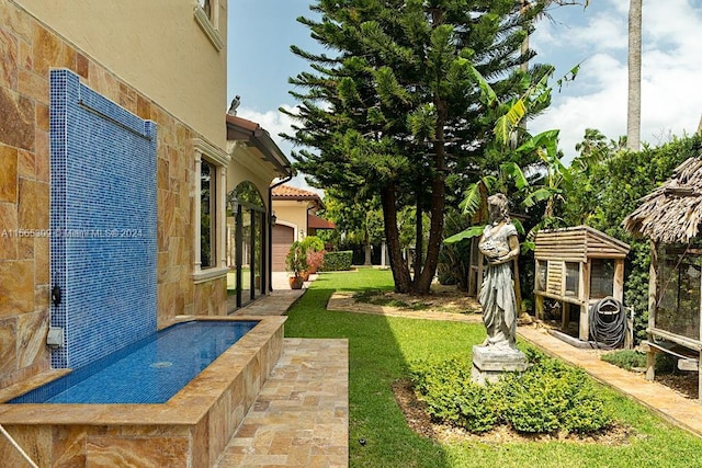 view of yard featuring a garage