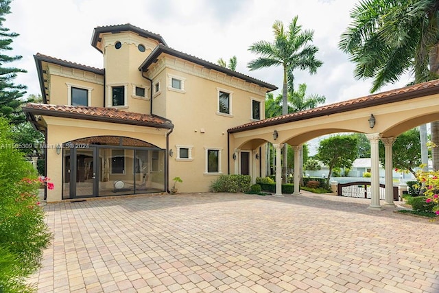 back of house with french doors and a patio