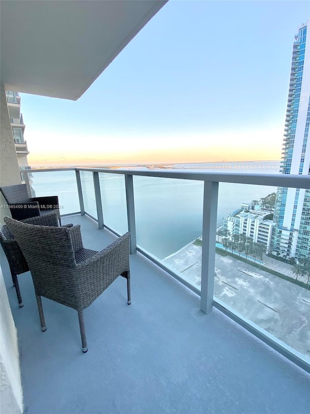 balcony at dusk with a water view