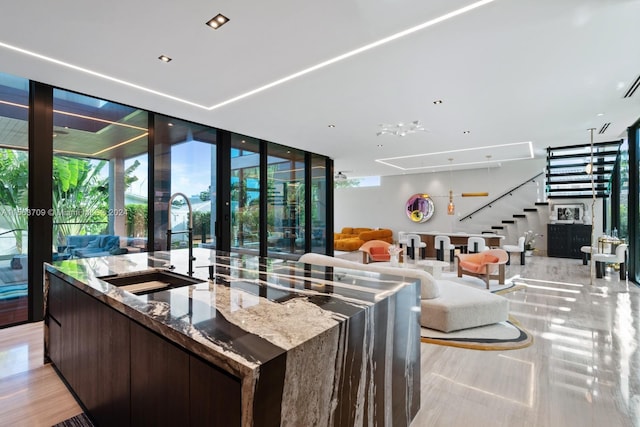 interior space with stairs and a wall of windows