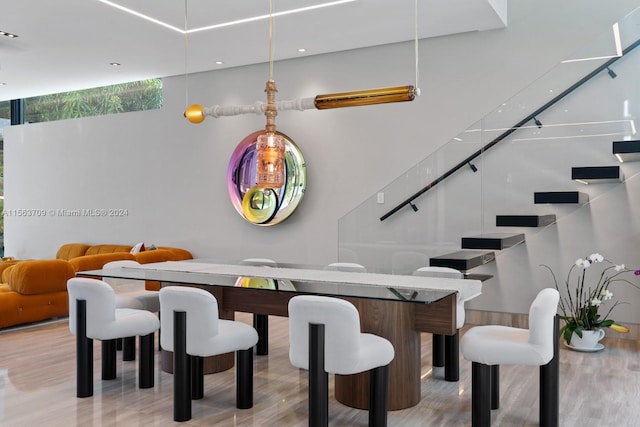 dining space with light wood finished floors