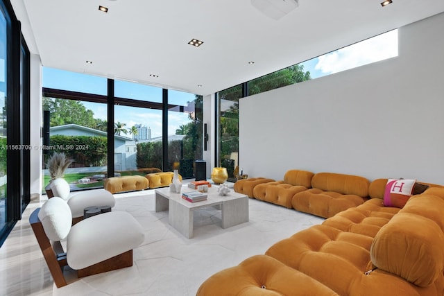 sunken living room with floor to ceiling windows