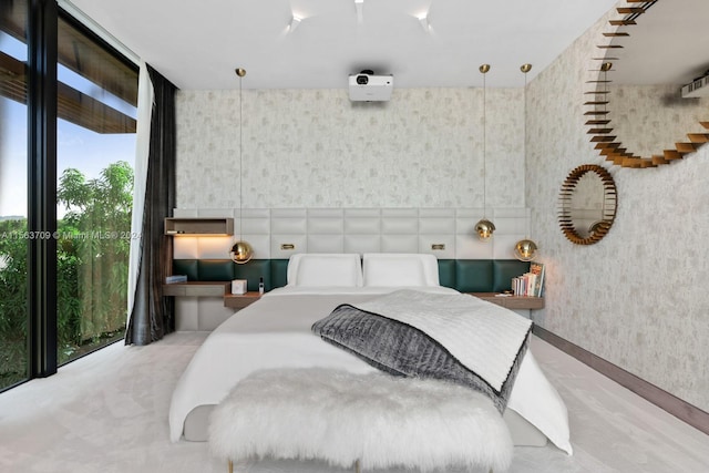 bedroom with floor to ceiling windows and wallpapered walls