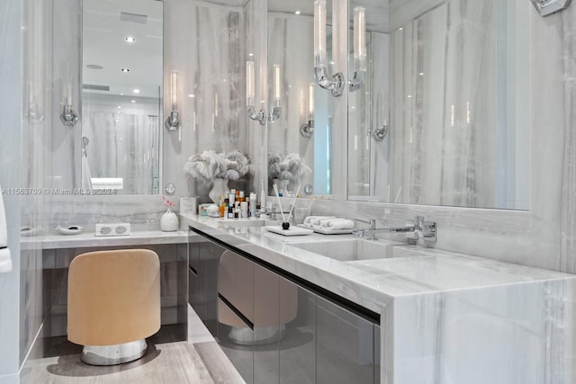 bathroom featuring double vanity and a sink