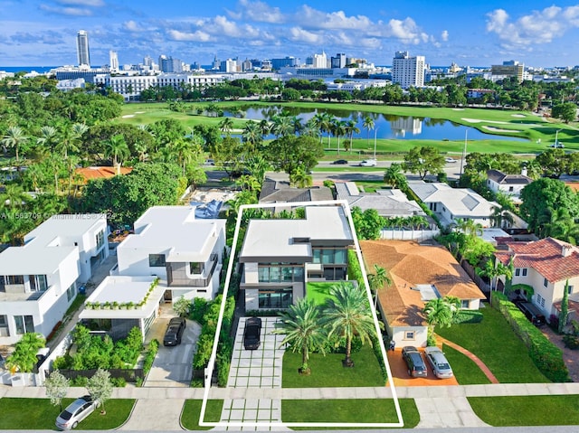 drone / aerial view featuring a water view and a city view