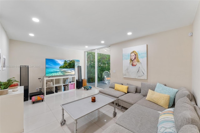 tiled living room with a wall of windows