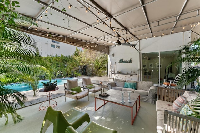 view of patio featuring pool water feature, ceiling fan, and an outdoor hangout area