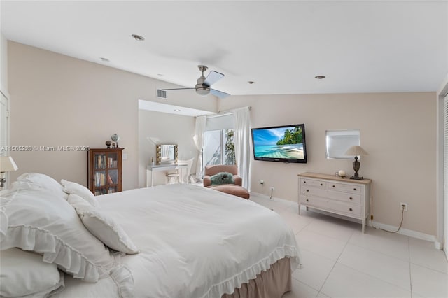 tiled bedroom with vaulted ceiling and ceiling fan