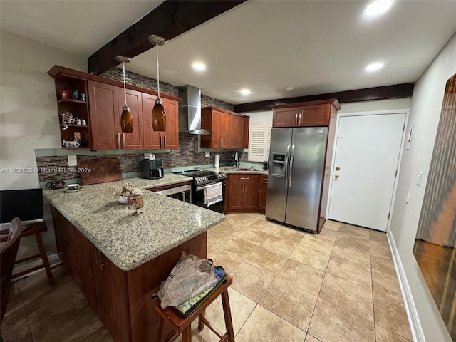 kitchen featuring appliances with stainless steel finishes, wall chimney range hood, light stone counters, light tile floors, and kitchen peninsula