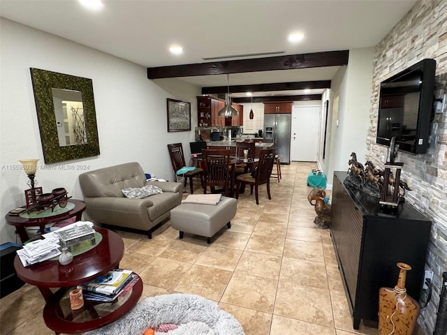 tiled living room featuring beamed ceiling