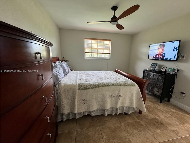 tiled bedroom with ceiling fan