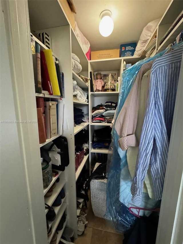 spacious closet with tile flooring