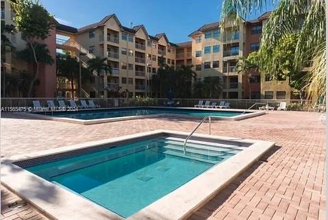 view of swimming pool featuring a patio area