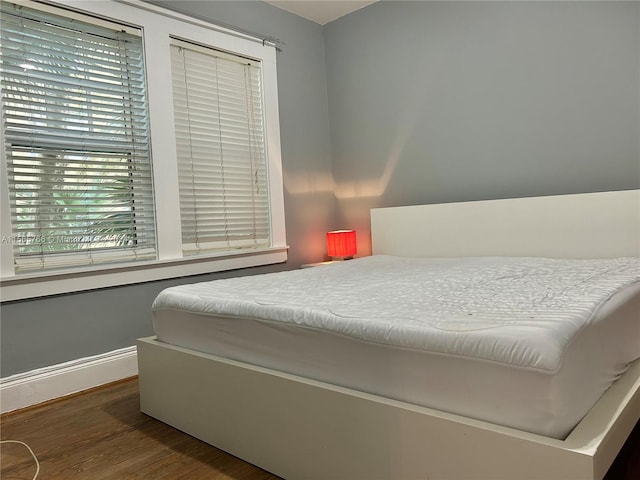 bedroom featuring dark wood-type flooring