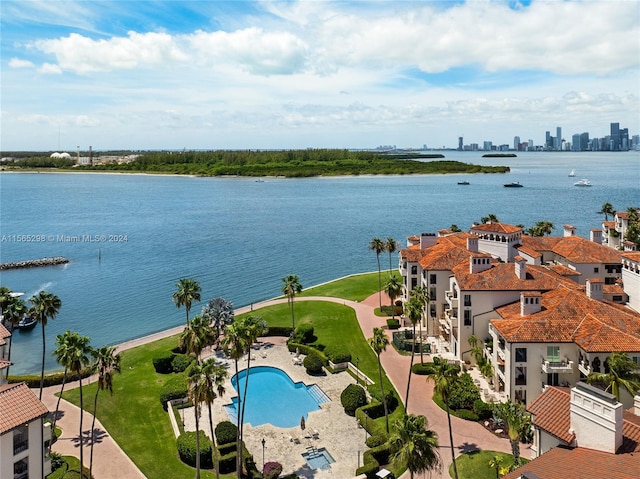 birds eye view of property with a water view