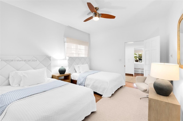 bedroom with ceiling fan and hardwood / wood-style flooring