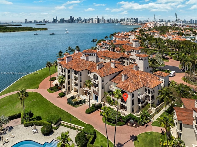 birds eye view of property featuring a water view