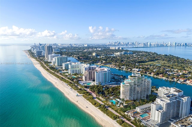 bird's eye view with a beach view and a water view