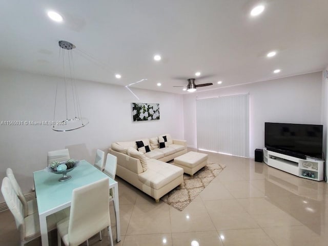 living room with ceiling fan and light tile floors