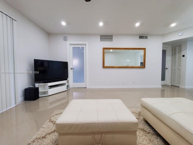 living room featuring light tile floors