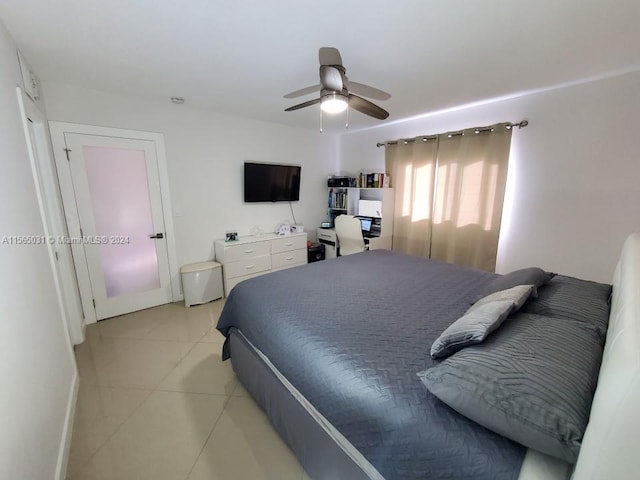 tiled bedroom with ceiling fan