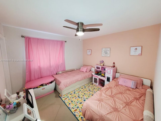 tiled bedroom with ceiling fan