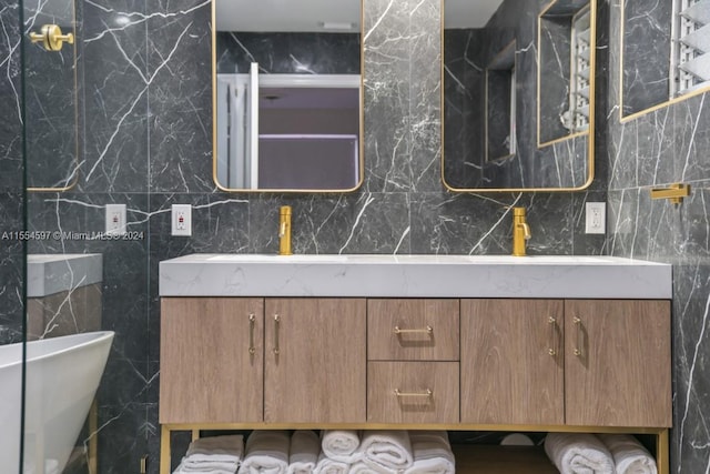 bathroom with tile walls and vanity