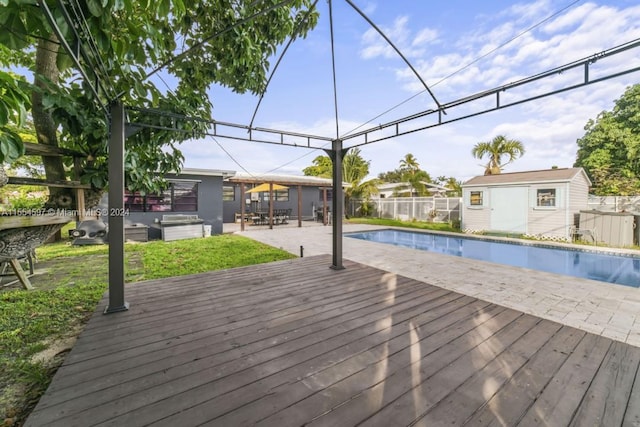 view of swimming pool featuring a wooden deck