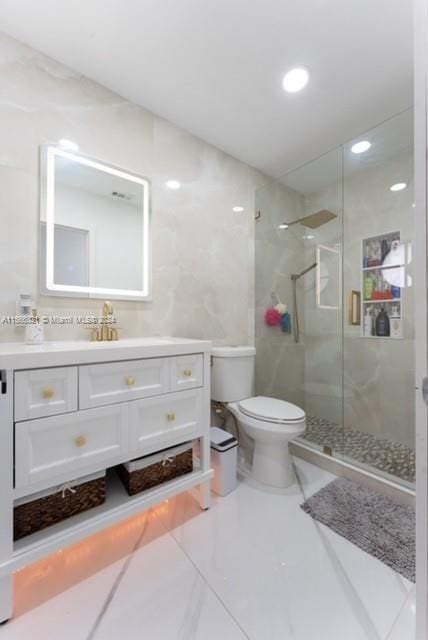 bathroom with vanity, tile patterned floors, and toilet