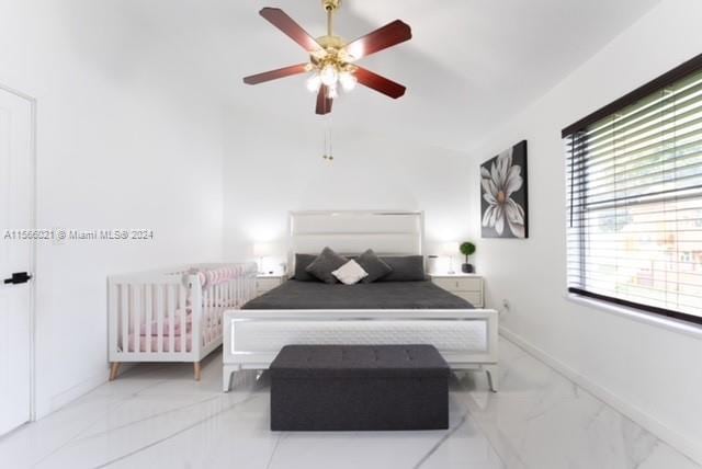 tiled bedroom with ceiling fan